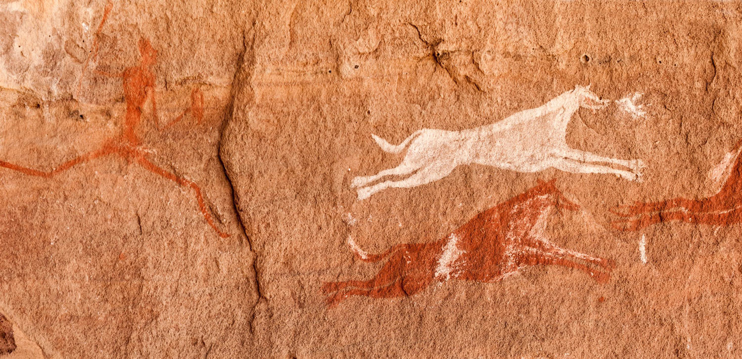 Escena naturalista rupestre, con presencia de perros Escena naturalista rupestre, con presencia de perros